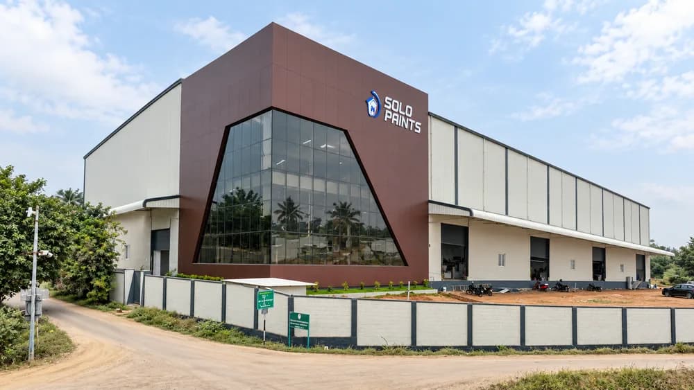 Industrial warehouse with a brown and glass entrance facade